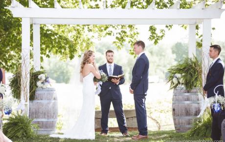 Ceremony under arbor at Flag Hill Winery. Photo by Jayna Cowal Photography - Ceremony Music Provided by Audio Events