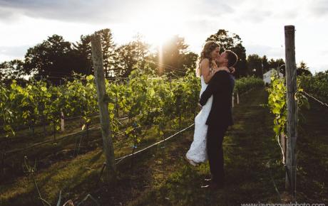 Emily and Matt hugging in the vineyard at Flag Hill Winery. Photo by Jayna Cowal Photography